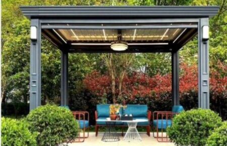 Modern outdoor seating area with blue chairs and greenery.