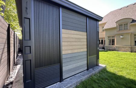 Garage door partially covered with plywood boards.
